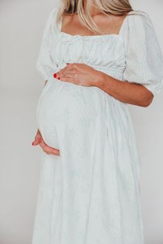 This gorgeous midi dress is absolutely dreamy and the perfect blend of coastal grandmother + modern romance. The sage floral print is subtle and sweet, and we can't get enough of the puffed sleeves and self-tie accents. Pair with sandals or heels for your next event when you need to RSVP "charming." FIT: Runs slightly large. Your pre-maternity size will accommodate most baby bumps. MATERIAL: 100% Polyester. GARMENT DETAILS: Midi dress with voluminous lined skirt, square neckline, and gathered se Spring Empire Waist Dress For Gatherings, Spring Gathering Empire Waist Dress, Spring Gatherings Empire Waist Dress, Modest Maternity Summer Dress, Spring Pastoral Dress For Gatherings, Spring Modest Flowy Maternity Dress, Modest Flowy Maternity Dress For Spring, Spring White Maxi Dress For Gatherings, White Spring Maxi Dress For Gatherings