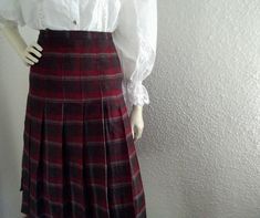 70s retro tartan skirt, spring pleated skirt, brown burgundy skirt, plaid elegant skirt, handmade paddleton skirt, preppy british college skirt, don't have lining, the fabric could be wool, but I cannot be sure about that.  the skirt is a little bit larger than apear on the photos because is adjusted to fit on the mannequin. measurements laying flat : waist:45cm (17,5 inches) hips :55 cm (21,5 inches) total lenght:66 cm (26 inches) Fall School Uniform Style Pleated Skirt, School Uniform Style Pleated Skirt For Fall, Fitted Plaid Skirt For School Uniform, Fall School Uniform Lined Skirt, Fitted Plaid Preppy Skirt, Vintage Full Pleated Skirt For Fall, Fitted Dark Academia Skirt For Fall, Vintage Fitted Mini Pleated Skirt, Fitted Vintage Mini Pleated Skirt