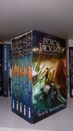 there are many books on the shelf together in this room, including one for percus jackson