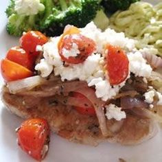 a white plate topped with meat and veggies