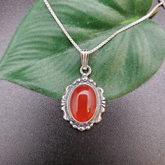 "Visit our on-line shop at: Etsy.com/shop/AlbuquerqueDesigns *sterling silver necklace pendant *Small pendant with silver box chain necklace 18\" *southwestern jewelry *carnelian / healing carnelian *calibrated pre-cut stones: 10x14mm oval shape *back of jewelry items are all covered / do not show the back of stones *all jewelry items are made to ship, slight variations in stones will occur comparing to pictures. *size of a penny is 19mm or a dime is 18mm in diameter for comparing size with jewe Silver Carnelian Pendant Necklace, Silver Carnelian Cabochon Necklace, Classic Orange Necklace For Gifts, Classic Orange Necklace For Gift, Classic Silver Carnelian Jewelry, Carnelian Oval Pendant Necklace As A Gift, Carnelian Oval Pendant Necklace For Gift, Stamped 925 Carnelian Jewelry, Silver Necklace Pendant