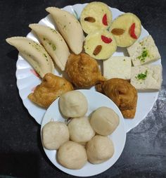 there are many different types of food on the plate, including dumplings and bread