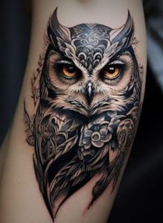 an owl tattoo is shown on the thigh