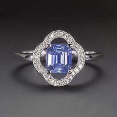 Why we love it:This beautiful sapphire and diamond ring features a gorgeous emerald cut sapphire paired with an elegant floral setting! The sapphire is inscribed in a scalloped frame of glittering diamonds.Highlights:- 0.96ct natural sapphire center with a bright cornflower blue hue- High quality Sri Lanka (Ceylon) sapphire- 0.14ct of high quality accent diamonds- 14k white gold settingDimensions:12.0mm across (north-south) and 3.5mm from the finger to the top of the ring. Cornflower Blue Sapphire Ring, Scalloped Frame, Ring Emerald Cut, Diamond Cocktail Ring, White Gold Sapphire, Sapphire And Diamond Ring, Ceylon Sapphire, Ring Emerald, Diamond Glitter