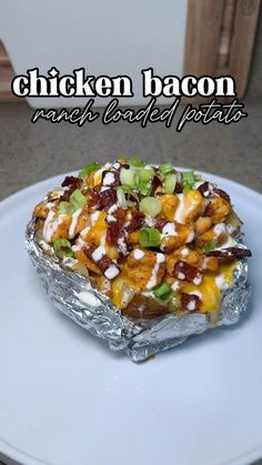 chicken bacon ranch baked potato on a white plate