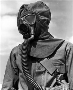 a man wearing a gas mask and jacket