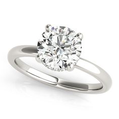 a white gold engagement ring with a round cut diamond