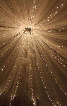 the ceiling is decorated with lights and drapes