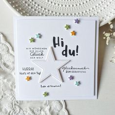 a greeting card with stars on it and the words hi dui written in german