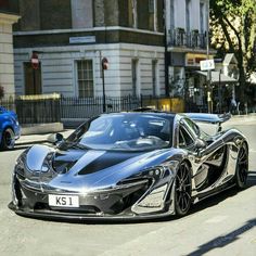 a silver and black sports car parked on the street