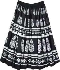 This is a Boho cotton mid-length full silhouette skirt with symmetrical white floral print running vertically throughout the length of the skirt.  Easy pull up style, lots of gathers at the waist and the skirt flows beautifully to a very pleated hem. #tlb #JuniorPetite #Floral #Printed #bohemianfashion #cottonskirt #flaredsummerskirt #blackandwhiteprintedskirt #midilengthskirt Spring Cotton Printed Skirt, Printed Cotton Skirt For Spring, Spring Cotton Skirt With Print, Traditional Skirt With Elastic Waistband For Spring, White Printed Long Skirt, White Long Cotton Skirt, Traditional Full Skirt Cotton Skirt, Traditional White Flowy Skirt, Traditional Cotton Pleated Skirt