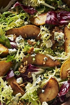 a salad with potatoes, lettuce and blue cheese