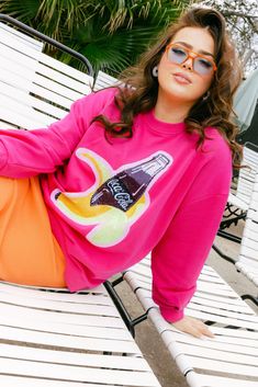 Hot Pink Banana Coca-Cola® Bottle Sweatshirt Fleece Graphic Print Sweatshirt For Athleisure, Fleece Athleisure Sweatshirt With Graphic Print, Athleisure Fleece Sweatshirt With Graphic Print, Casual Pink Crew Hoodie, Graphic Print French Terry Sweatshirt For Loungewear, Pink Athleisure Sweatshirt For Leisure, Oversized Graphic Print Sweater In Athleisure Style, Oversized Graphic Print Fleece Sweats, Sporty Pink Sweater With Graphic Print