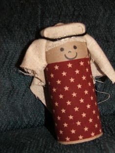 a doll made out of toilet paper with stars on it