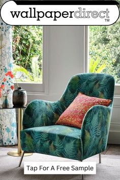 a green chair sitting in front of a window with the words wallpaper direct on it