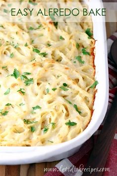 a casserole dish with cheese and parsley