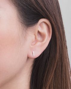 "With an eclectic look and a unique design, these Dainty Earrings are on-trend and amazing! Handmade and beautiful, these dainty earrings are an excellent example of tiny stud earrings! LISTING Bar Stud Earrings DETAILS * Stud bar measures approximately 0.25\" x 0.04\" (6,5mm long x 1,2mm thick) * Earring backs are sterling silver scrolls. * Earring post length is 0.39\" (10mm). * Sold as a pair. * This listing is for a pair of stud earrings only. MATERIALS * 18K Rose Gold Plated * 24k Yellow Go Staple Earrings, Small Stud Earrings, Earrings Minimal, Minimal Earrings, Bar Stud Earrings, Tiny Stud Earrings, Tiny Studs, Small Earrings Studs, Bar Earrings