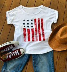 4th of July Womens Shirt. American Flag Top. Memorial Day Shirt. Graphic Tshirt. Country Music. USA shirt. All photos and designs are by Tanya Visconti of Rain Dancer Clothing Copyright 2015 All rights reserved The dolman rolled sleeve top has quickly become a favorite! Simple. Classy. Versatile. American. Pair it with your favorite boyfriend jeans, maxi shirt, or yoga pants. Throw it on over your bathing suit with flip flops and shorts for a 4th of July party. This top is PERFECT for throwing o Summer Flag Print T-shirt With Relaxed Fit, Casual Crew Neck T-shirt With Flag Print, American Style Pre-shrunk Short Sleeve Shirt, Cotton Crew Neck T-shirt With Flag Print, Summer Americana Style Short Sleeve T-shirt, Summer Cotton Fan Apparel T-shirt, Patriotic Screen Print Tops For Memorial Day, Short Sleeve Cotton Americana Shirt, American Style Pre-shrunk Cotton T-shirt