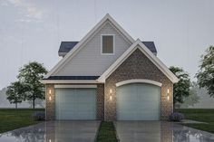 a two story brick house with garages and lights