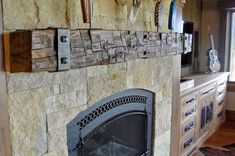 a living room with a fire place next to a tv on a wall above a fireplace