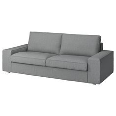 a gray couch sitting on top of a white floor