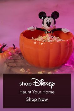 a mickey mouse in a pumpkin bowl with the words shop your home for halloween now