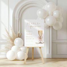 there is a sign and some balloons in front of the door to a bridal shower