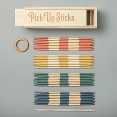 the pick - up sticks are lined up next to each other