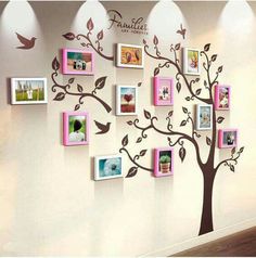 a family tree with many pictures on it and birds flying around the branches in pink frames