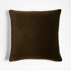 a dark brown pillow on a white background