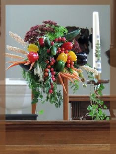 a vase filled with lots of different types of flowers