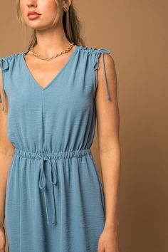 Elevate your summer wardrobe with the Raelyn Sleeveless V-neck Mini Dress, a perfect blend of flirty style and feminine details. This dress showcases a flattering V-neckline and delicate shoulder ruching, creating a chic and figure-enhancing silhouette. Whether paired with sandals for a daytime look or heels for an evening out, the Sleeveless V-neck Shoulder Ruching Mini Dress offers a versatile and stylish choice that's perfect for warm-weather occasions.Model is 5’10” wearing a size small Fabric Contents: 100% Polyester, Non-stretch fabric, Non-sheer fabricSize Measurement (inch): S: 17.5 (Bust), null (Waist), null (Hips), 43.0 (Length) M: 18.0 (Bust), null (Waist), null (Hips), 43.5 (Length) L: 18.5 (Bust), null (Waist), null (Hips), 44.0 (Length) Flirty Style, Kids Activewear, Timeless Dress, Long Sleeve Kids, Ruched Midi Dress, Mid Length Skirts, Mini Dress Casual, Sheer Fabrics, Simply Beautiful