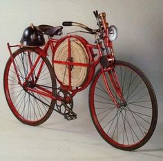 a red bicycle with a basket on the front wheel