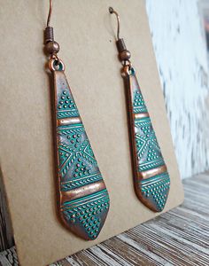 These earrings are made from a metal alloy with a copper finish and a blue/green patina. They dangle approximately 1.75" from coordinating copper colored earwire. Green Copper Earrings With Patina, Bohemian Copper Earrings With Patina, Copper Teardrop Earrings With Patina, Bohemian Bronze Earrings With Patina, Green Patina Bohemian Earrings, Green Bohemian Earrings With Patina, Green Bohemian Patina Earrings, Bohemian Green Patina Earrings, Patina Earrings