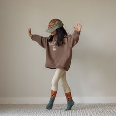 This hat is made by Rad River Co. in collaboration with Summer in May. Features an adjustable velcro back and fabric eyelets on the side panels. Size 1: Designed to fit kids aged 9 to 36 months.Size 2: Designed to fit kids aged 3 to 5 years.Size 3: Designed to fit kids aged 6 to 10 years. *Models 1 and 2 are wearing size 2*Models 3 and 4 are wearing size 3 100% Polyester Playful Adjustable Cotton Hat, Playful Cotton Hat With Adjustable Fit, Playful Brown Hat, One Size Fits Most, Playful Brown Cap Hat, Playful Brown Cap, Playful Brown Adjustable Hat, Playful Cotton Outdoor Hat, Casual Beanie For Playtime, Playful Adjustable Hats For Fall