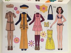 an image of paper doll clothes on display