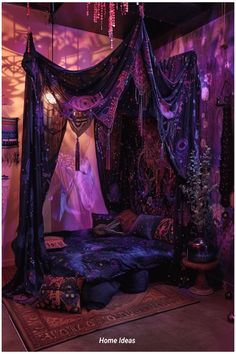 a purple canopy bed with curtains and pillows