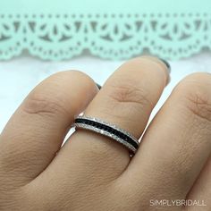 a woman's hand with a ring on it