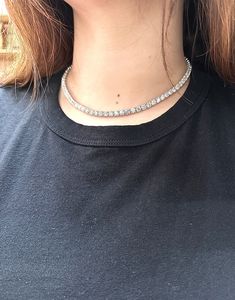 30.10 Carat Diamond Tennis Necklace G SI 14K White Gold 16 inches 100% Natural Diamonds, Not Enhanced in any way Round Cut Diamond Necklace 30.10CT (each stone is 0.35ct) G-H SI 14K White Gold, Prong, 13.30 gram 16 inches in length, 4.5 mm in width 86 Diamonds N5675.35W16 ALL OUR ITEMS ARE AVAILABLE TO BE ORDERED IN 14K WHITE, ROSE OR YELLOW GOLD UPON REQUEST. All Chains of Pendants and Necklaces Can be Requested in 16'' or 18'' Length. . This item is proudly handcrafted in the USA. Perfect gift Classic Crystal Tennis Necklace With 17 Jewels, Aaa Quality Diamond Necklace For Anniversary, Fine Jewelry Crystal Tennis Necklace, Classic Round Rhinestone Necklace For Anniversary, Diamond White Tennis Necklace With Sparkling Stones, Crystal Tennis Necklace For Anniversary, Round Cut Sparkling Stones Tennis Necklace For Anniversary, Round Cut Tennis Necklace With Sparkling Stones For Anniversary, Anniversary Tennis Necklace With Sparkling Round Cut Stones