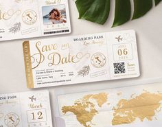 three boarding cards with gold foil on them next to green leaves and a world map