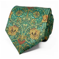 The intricate floral design features yellow flowers set against a soft green background, creating a classic yet eye-catching look. Crafted from high-quality fabric, this necktie has a luxurious feel on the touch that exudes old-world charm. It's the perfect accessory for those who appreciate vintage style and want to add a touch of retro charm to their outfit.  Measuring approx. 145cm in length and 8cm at its widest point. We offer the convenience of selecting a neat packaging option for your ti Green Luxury Suit And Tie Accessories, Green Suit With Tie, Elegant Green Summer Ties, Elegant Green Summer Tie, Green Summer Ties For Formal Occasions, Spring Green Formal Tie, Spring Formal Green Tie, Formal Green Spring Tie, Summer Formal Green Ties