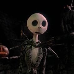 jack skellingy from the nightmare before it was dark in the night, with two pumpkins behind him