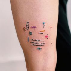 a woman's arm with tattoos on it and words written all over the place