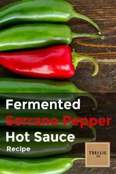 some green and red peppers sitting on top of a wooden table with the words ferment