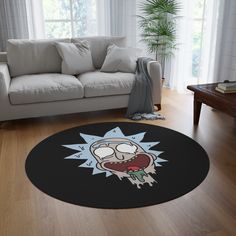 a living room with a couch and rug that has an image of cartoon characters on it