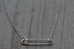 "This is a Sterling Silver Safety Pin Necklace which is 17.50 inches(44.5 cm) long.The safety pin on the necklace is 1.18 inches(3 cm) long. The weight of the necklace is 3.4gr. Please leave a note if you want diffirent length. I hallmark all the items.Here is some details of the item: Sterling Silver-Glossy finish-Hand made-925 Stamped The Sterling Silver Safety Pin Necklace is shipped in a really nice gift box. Here is some general information about Sterling Silver: Sterling silver is an alloy How To Make A Safety Pin Necklace, Safety Pins Necklace, Safety Pin Necklace, Safety Pin Bracelet, Girlfriend Necklace Gift, Girlfriend Necklace, Safety Pin Jewelry, Pin Necklace, Bead Charms Diy