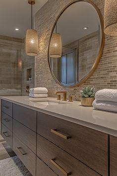 a bathroom with a large mirror above the sink