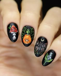 Lexa on Instagram: "I'm actually wearing these right now 🤗 🍄🎃🦋🌱 Inspired by @macharaology 🖤✨ I rarely opt for a matte nail, but this design just needed it. Loved spending time to shade these, but the eyes and the tiny skulls were a pain in the a$$ 😅 Handpainted with acrylic paint over a black nail polish. #freehandnailart #nailart #halloween #halloweennails #nailitdaily #fallnails #autumnnails #spookynails #blacknails #nailsoftheday #nailsofinstagram #nails2inspire #mattenails" Matt Nail Art, Nail Art Matte, Nailart Halloween, Rasta Nails, Winter Nail Art Designs, Matte Nail Art, Witch Nails