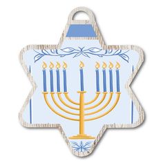 a wooden hanukkah hanging ornament with candles