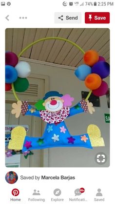 an image of a clown with balloons on his head and arms in the shape of a circle